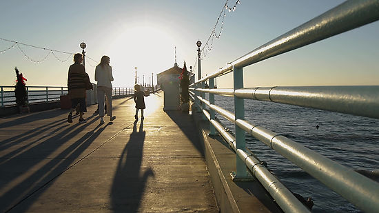 Family Walking on Pier